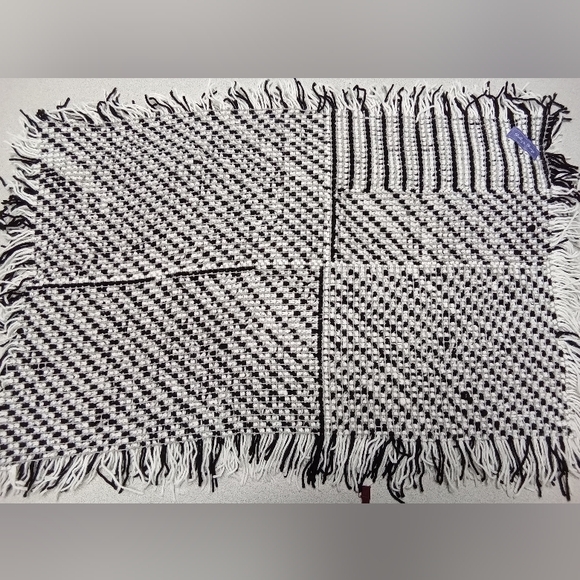 Black and White Shag Rug Against a Gray Background - Picture 2 of 3